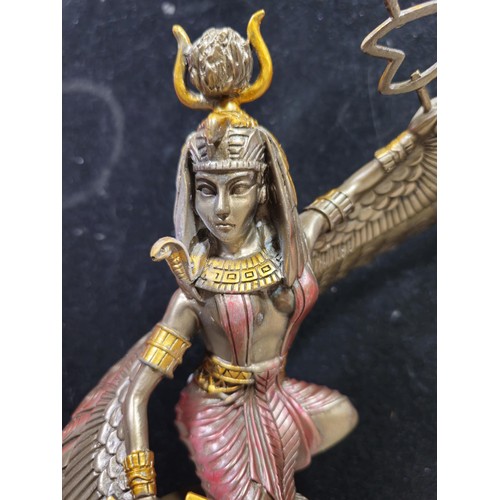 81 - A good quality wooden wall hanging in the form of a Buddha's head along with a resin Egyptian Goddes... 