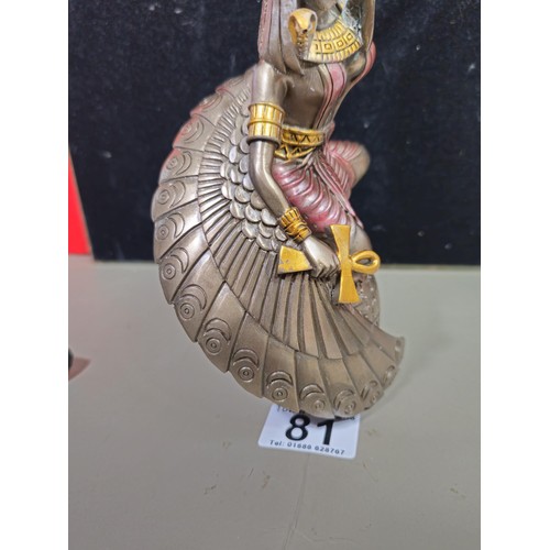 81 - A good quality wooden wall hanging in the form of a Buddha's head along with a resin Egyptian Goddes... 