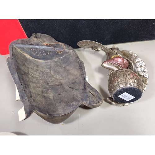 81 - A good quality wooden wall hanging in the form of a Buddha's head along with a resin Egyptian Goddes... 