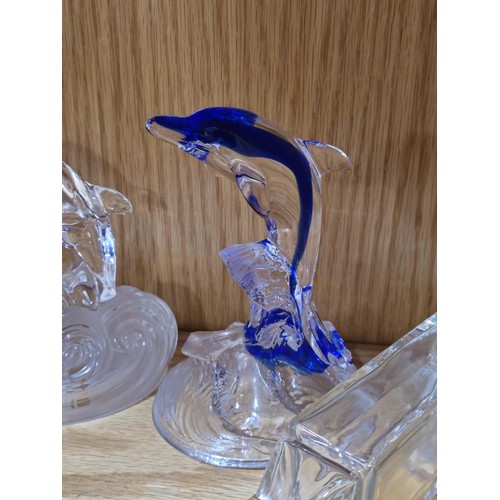 88 - A collection of 4x french art glass dolphin figures to include one in blue all riding a crest of a w... 
