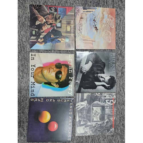 97 - A selection of vinyl records, to include some popular artists. Albums by 10cc, Brian Ferry, Billy Jo... 