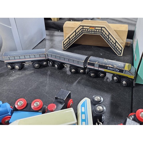 100 - Quantity of wooden children's railway set with wooden track and trains along with a bridge and a Fis... 