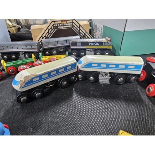 100 - Quantity of wooden children's railway set with wooden track and trains along with a bridge and a Fis... 