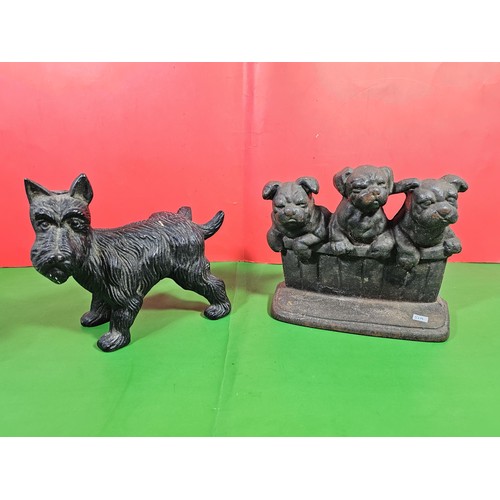103A - 2x good quality vintage cast iron door stops to include one in the form of a dog cocking its leg and... 