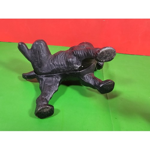 103A - 2x good quality vintage cast iron door stops to include one in the form of a dog cocking its leg and... 