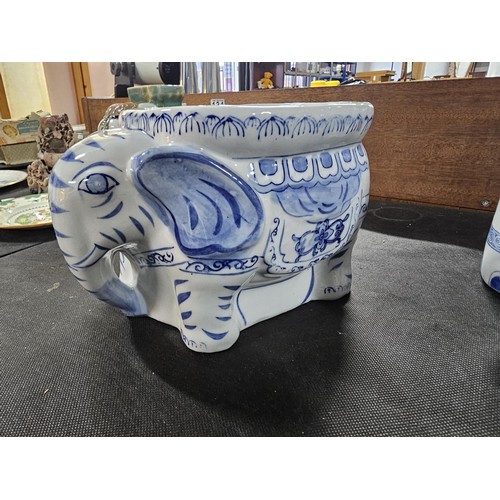 105 - 2x blue and white ceramic elephant items to include a blue and white jardiniere stand along with a p... 