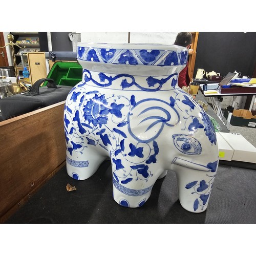 105 - 2x blue and white ceramic elephant items to include a blue and white jardiniere stand along with a p... 