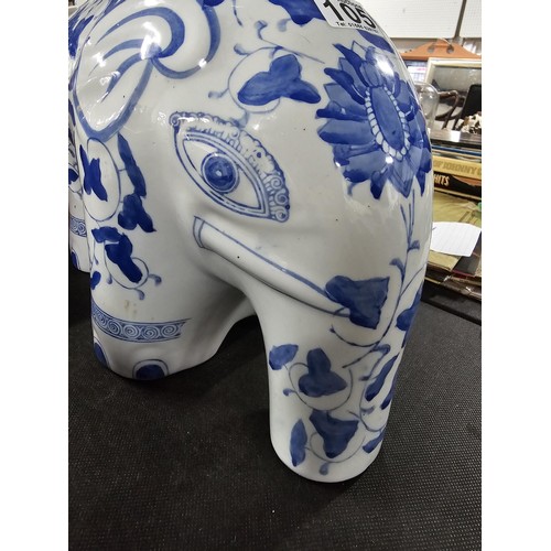 105 - 2x blue and white ceramic elephant items to include a blue and white jardiniere stand along with a p... 