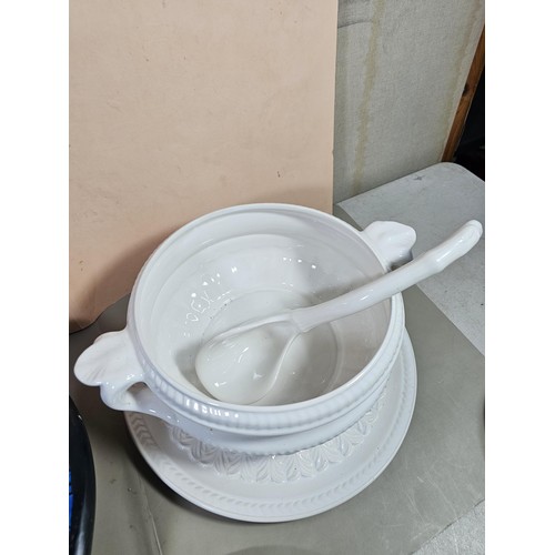 96 - A good quality white large lided tureen with a large ladle standing on a matching tray with a leaf d... 
