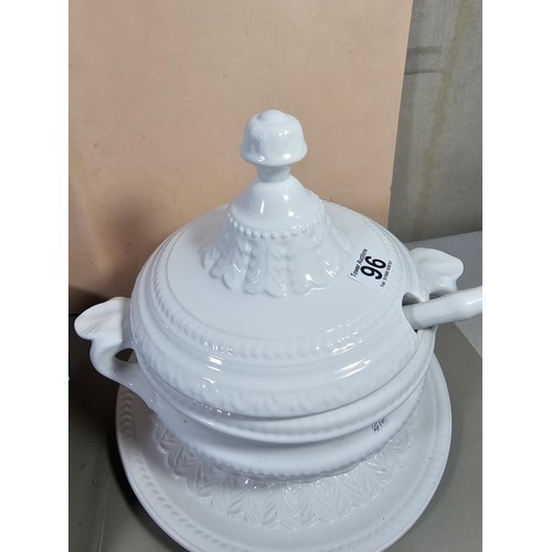 96 - A good quality white large lided tureen with a large ladle standing on a matching tray with a leaf d... 