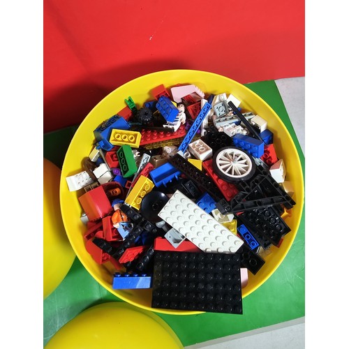 114 - 2x original Lego containers in the form of Lego heads both full of Lego pieces along with 3x jigsaws... 