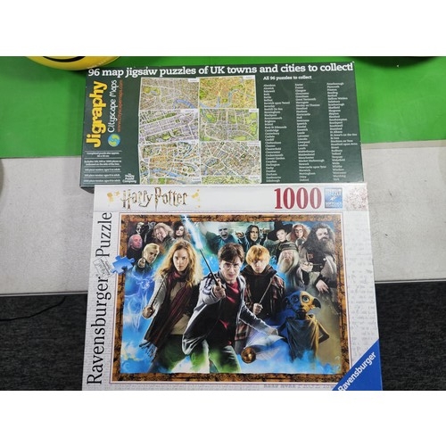 114 - 2x original Lego containers in the form of Lego heads both full of Lego pieces along with 3x jigsaws... 