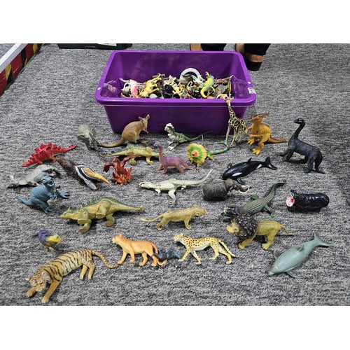 113 - Collection of rubber and plastic toys in the form of dinosaurs and zoo animals to include an articul... 