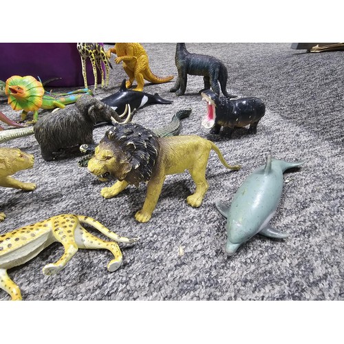 113 - Collection of rubber and plastic toys in the form of dinosaurs and zoo animals to include an articul... 