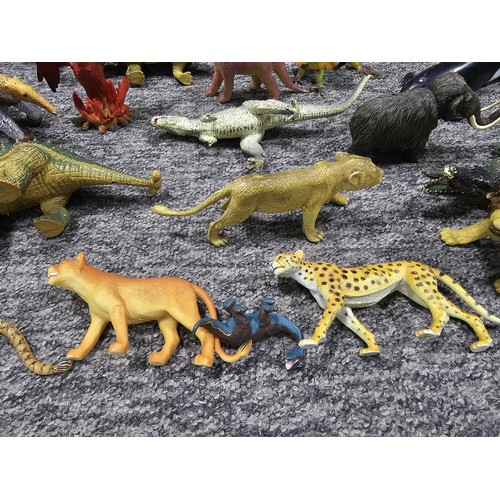 113 - Collection of rubber and plastic toys in the form of dinosaurs and zoo animals to include an articul... 