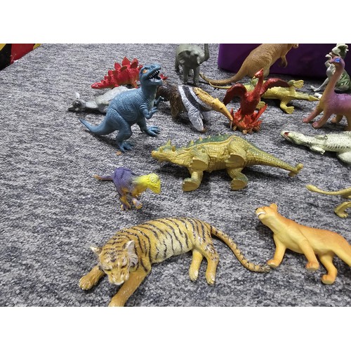 113 - Collection of rubber and plastic toys in the form of dinosaurs and zoo animals to include an articul... 