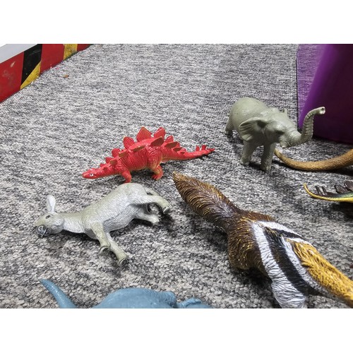 113 - Collection of rubber and plastic toys in the form of dinosaurs and zoo animals to include an articul... 