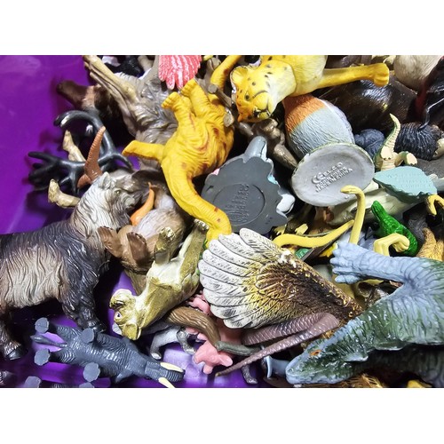113 - Collection of rubber and plastic toys in the form of dinosaurs and zoo animals to include an articul... 
