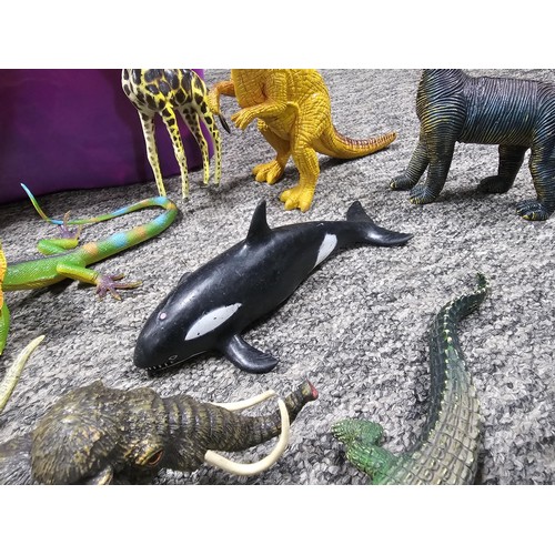 113 - Collection of rubber and plastic toys in the form of dinosaurs and zoo animals to include an articul... 
