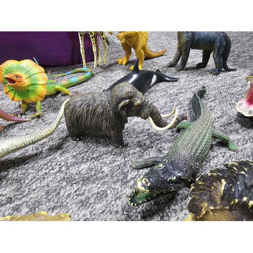 113 - Collection of rubber and plastic toys in the form of dinosaurs and zoo animals to include an articul... 
