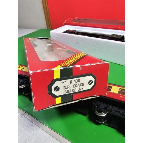 112 - 2x boxed Hornby train and carriage to include a 4-6-2 Class 7 Britannia loco and tender in british r... 