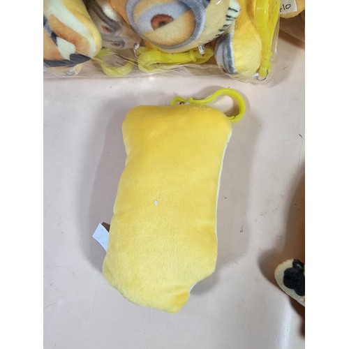 115 - Collection of Minion style key ring in the form of a small yellow plush toy with a plastic fastener,... 