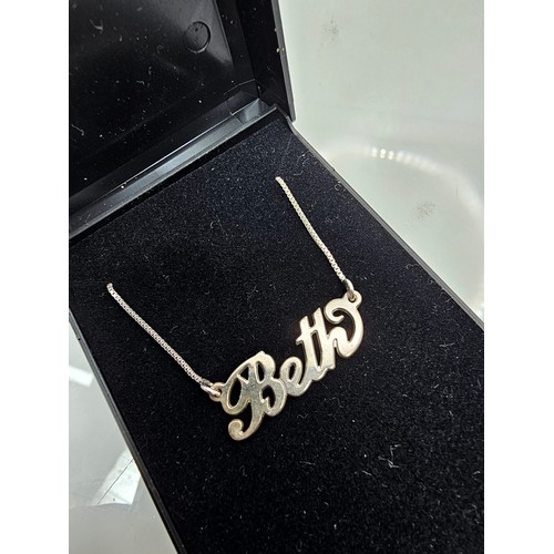 A 925 silver necklace featuring a 925 silver pendant with the name ...