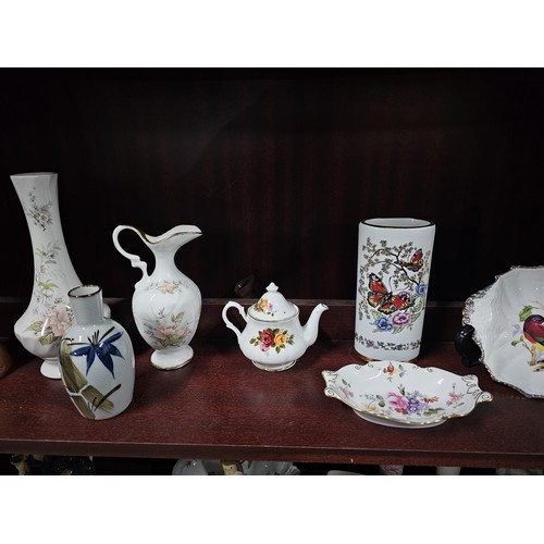 75 - A large collection of assorted ceramics to include a trefoil dish, a Goebel angel figure, a Nadal la... 