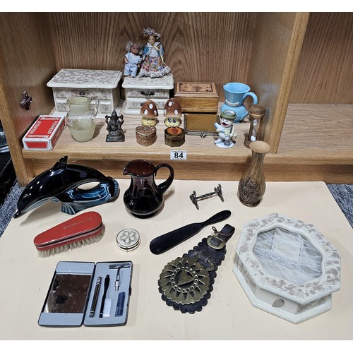 84 - A shelf full of collectables to include 2x white jewellery boxes along with a toadstool formed cruet... 
