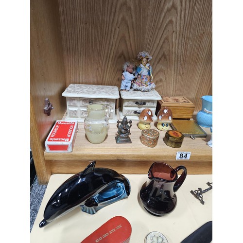 84 - A shelf full of collectables to include 2x white jewellery boxes along with a toadstool formed cruet... 