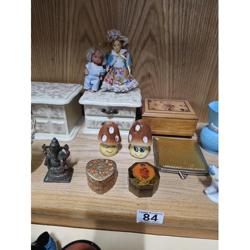 84 - A shelf full of collectables to include 2x white jewellery boxes along with a toadstool formed cruet... 