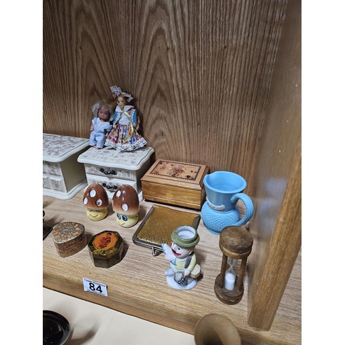 84 - A shelf full of collectables to include 2x white jewellery boxes along with a toadstool formed cruet... 
