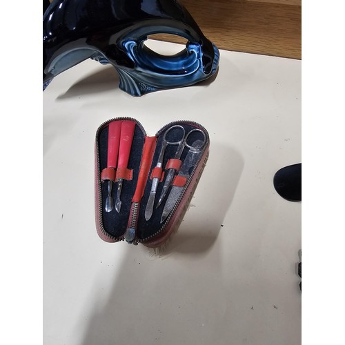 84 - A shelf full of collectables to include 2x white jewellery boxes along with a toadstool formed cruet... 