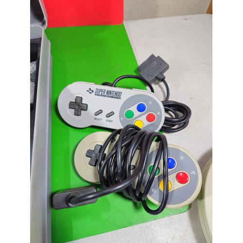 133 - A cased Super Nintendo Entertainment System in a rare Original Nintendo case, model number SNSP-001A... 