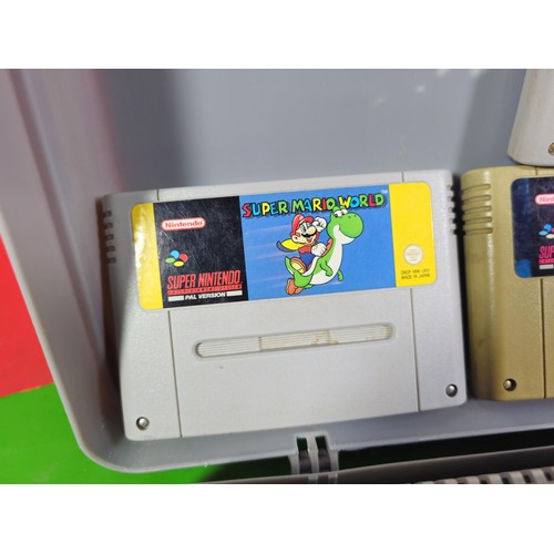 133 - A cased Super Nintendo Entertainment System in a rare Original Nintendo case, model number SNSP-001A... 