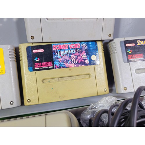 133 - A cased Super Nintendo Entertainment System in a rare Original Nintendo case, model number SNSP-001A... 