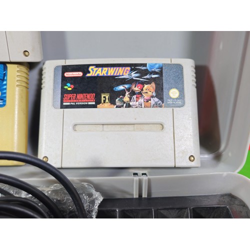 133 - A cased Super Nintendo Entertainment System in a rare Original Nintendo case, model number SNSP-001A... 