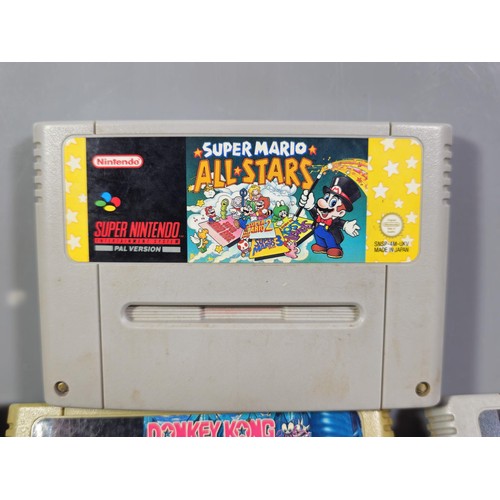 133 - A cased Super Nintendo Entertainment System in a rare Original Nintendo case, model number SNSP-001A... 