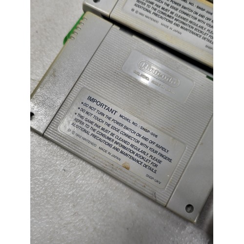 133 - A cased Super Nintendo Entertainment System in a rare Original Nintendo case, model number SNSP-001A... 