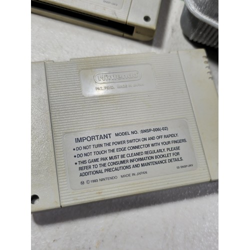 133 - A cased Super Nintendo Entertainment System in a rare Original Nintendo case, model number SNSP-001A... 