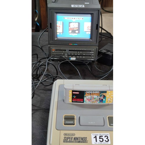 133 - A cased Super Nintendo Entertainment System in a rare Original Nintendo case, model number SNSP-001A... 