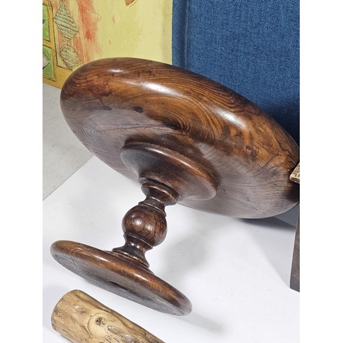 141 - A selection of wooden items to include a wooden hand turned bowl on a pedestal stand along with a wo... 