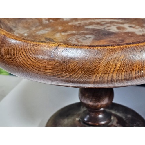 141 - A selection of wooden items to include a wooden hand turned bowl on a pedestal stand along with a wo... 