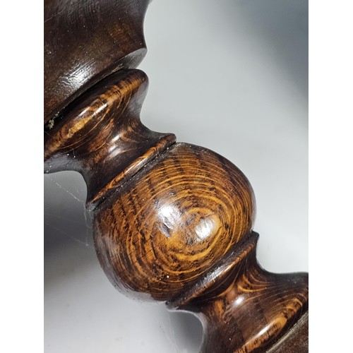 141 - A selection of wooden items to include a wooden hand turned bowl on a pedestal stand along with a wo... 