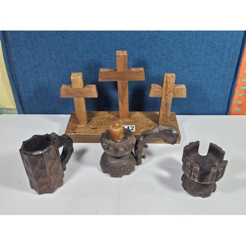 142 - A collection of wooden items to include 3x wooden crosses set into a wooden base along with 3x rusti... 