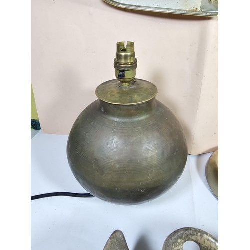 143 - A collection of three lights to include a brass table top light with a flexible neck, a brass lamp w... 