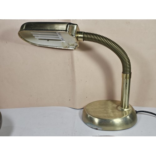 143 - A collection of three lights to include a brass table top light with a flexible neck, a brass lamp w... 