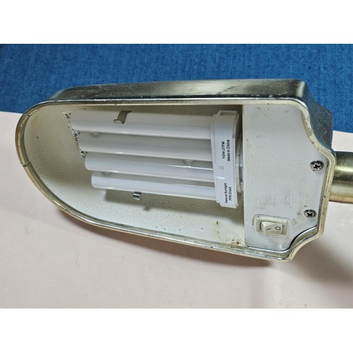 143 - A collection of three lights to include a brass table top light with a flexible neck, a brass lamp w... 