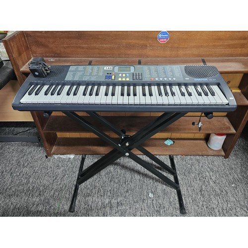 148 - A good quality Farfisa TK57 electronic keyboard with stand, in working order, has an electronic soun... 