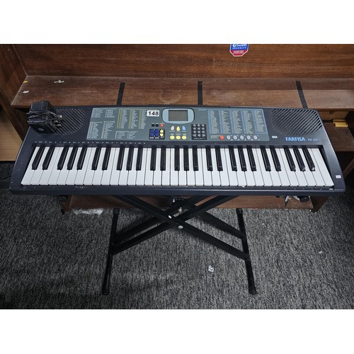 148 - A good quality Farfisa TK57 electronic keyboard with stand, in working order, has an electronic soun... 